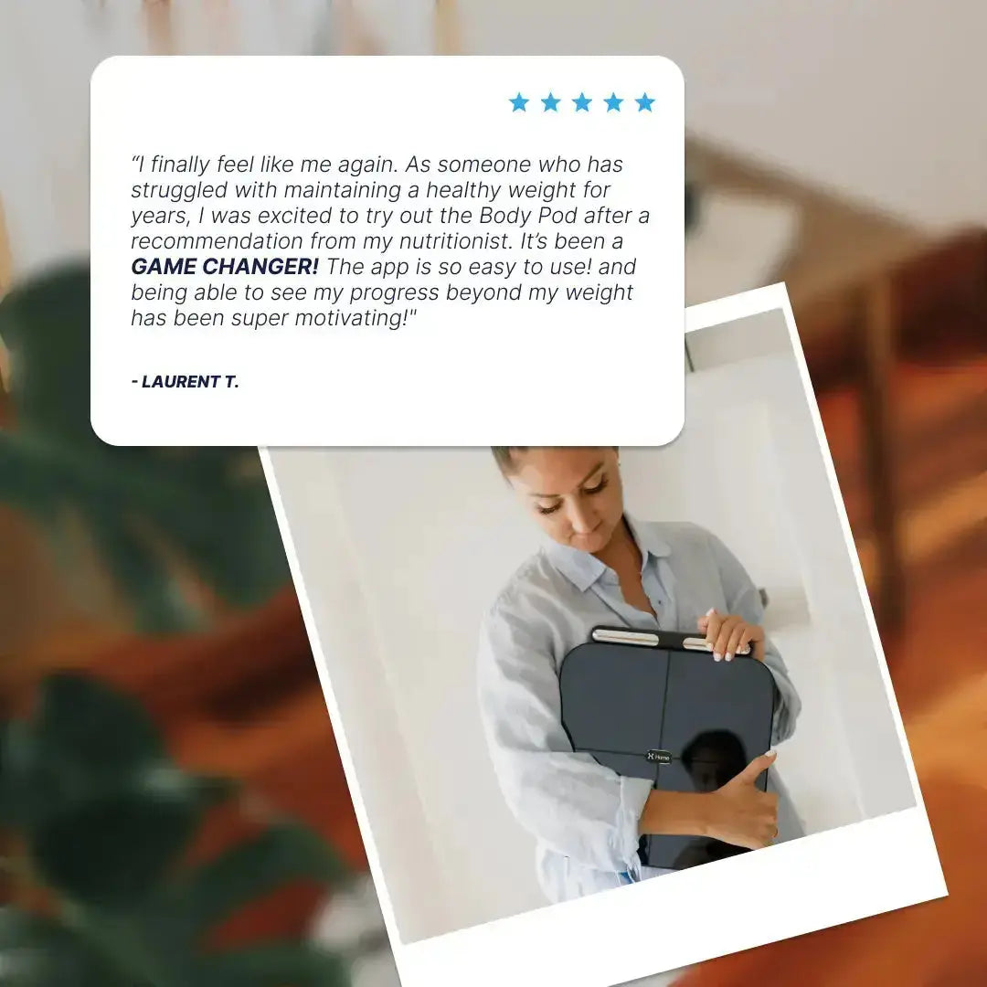 Woman holding Hume Body Pod with product review